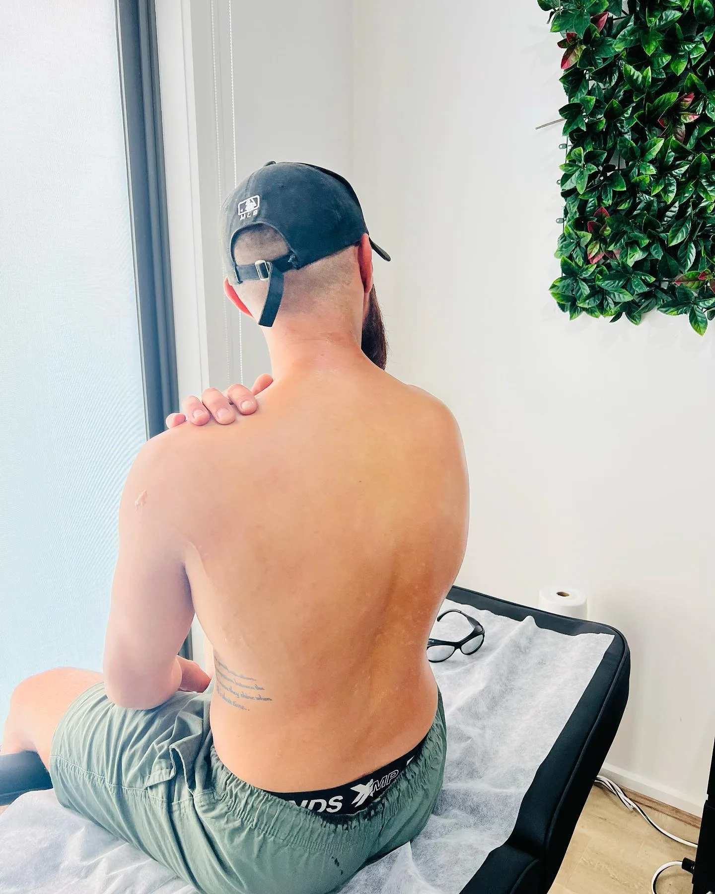 Back and shoulders wax in progress in the Keysborough studio